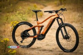 Orange Haibike electric mountain bike on an offroad gravel track.