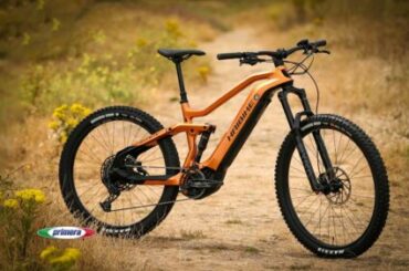 Orange Haibike electric mountain bike on an offroad gravel track.