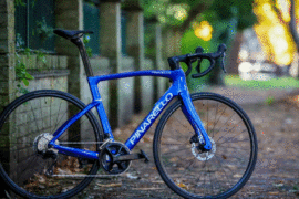 Blue pinarello f1 bike outside on path